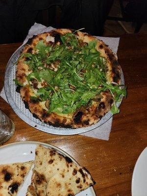 Onion, mushroom arugula with white truffle oil pizza