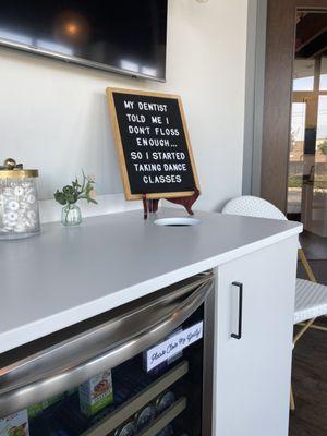 Reception area with beverage refrigerator.