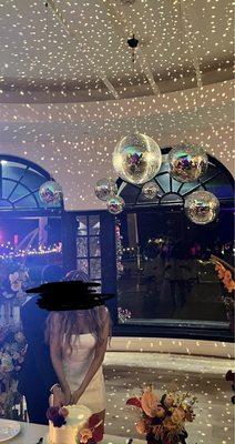 Disco balls installed for our reception at Spanish Hills Club.