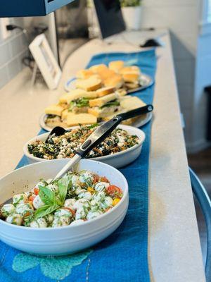 Caprese salad, kale lentil salad, pulled pork sliders, chicken salad sandwiches