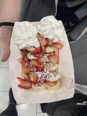 Mini pancakes, maple syrup, strawberries, powder sugar and whipped cream