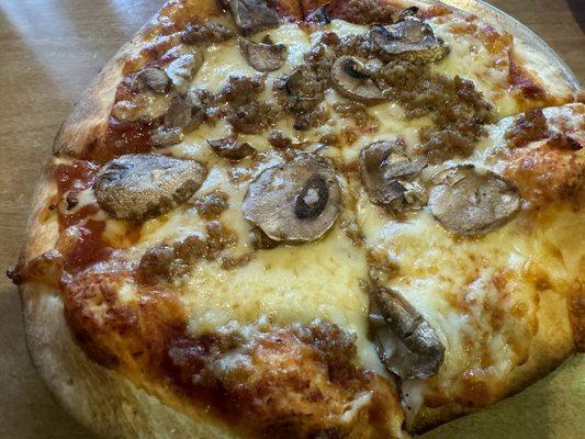 Small Italian sausage and mushroom pizza