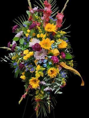 Standing easel spray in vibrant late summer blooms makes a statement.