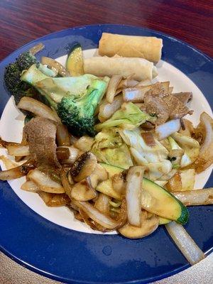 Vegetables and meat cooked on the grill.