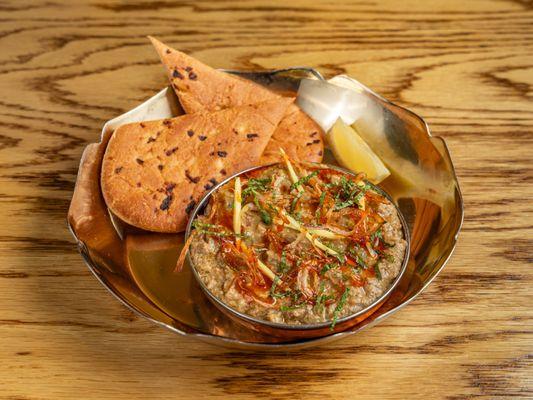 HALEEM

slow cooked goat stew with lentils, taftan bread. (inspired by an Arabian dish harees dating back to 10th century- from Hydrabad