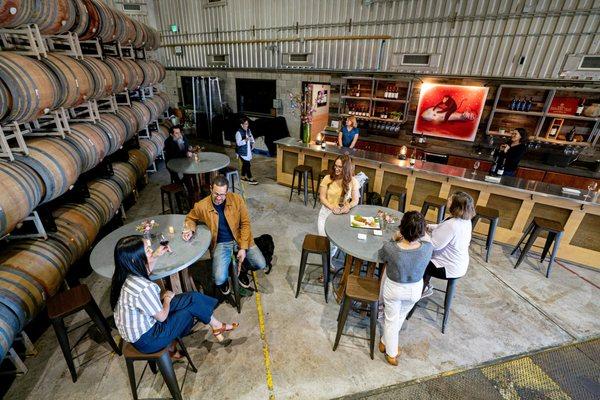 Surrounded by barrels in the winery hangar