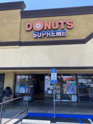 The sign reads Donuts supreme but the biz name is actually Supreme Donuts