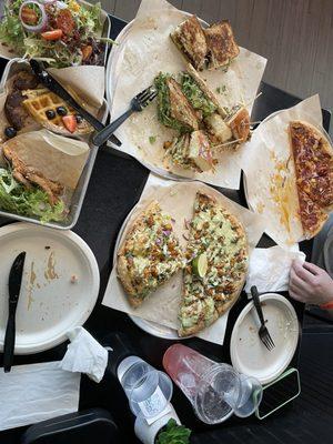 Sampler platter of three sandwiches and two pizzas