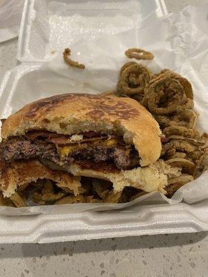 Cheeseburger with bacon on jalapeño sourdough bun with fried jalapeños on the side