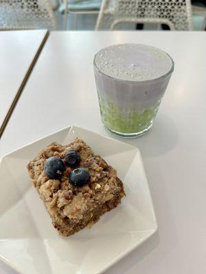 Iced matcha latte with blueberry foam and blueberry orange coffee cake