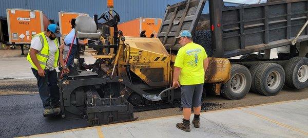 Murrary's Asphalt Team Laying Asphalt