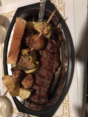 Ribeye dinner with veggie skewers. Comes with salad, too.