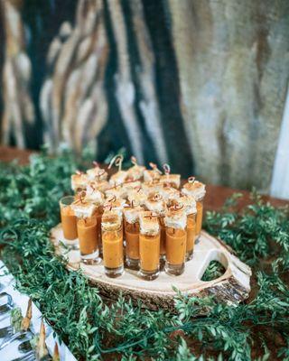 Tomato bisque shooters topped with grilled cheese!