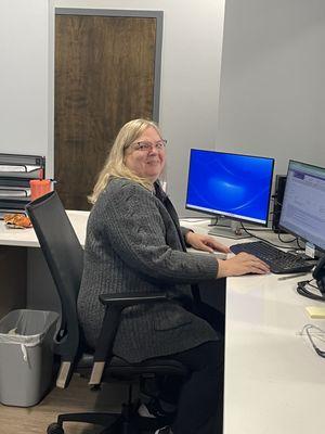 Medical receptionist smiling