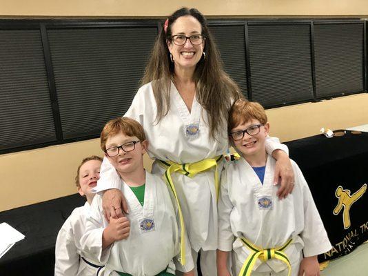 My boys and I at a belt promotion ceremony. With a family membership, the whole family can attend classes together!