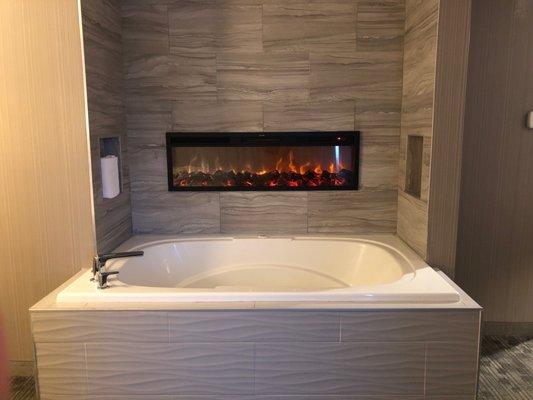 Jacuzzi tub and fireplace