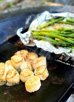 Seared scallops and asparagus over an open fire.  Mmmmm.