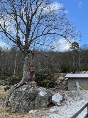 View from the conveyor belt - wood carving under tree