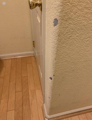 Dings in wall not repaired or painted.