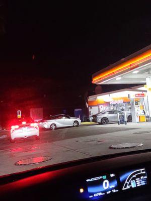 Line of 8 cars to get fuel at 10 PM