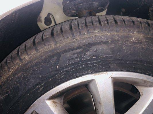 Does this tire look new to you?  Charging full price for a new tire only to install an used one. Don't give them your business.