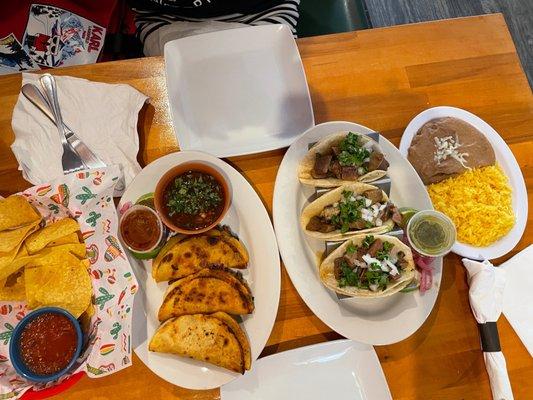 Quesabirria, tacos de lengua, chips, rice and refried beans. What's not to like?