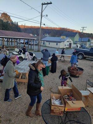 People gathering around the firepit