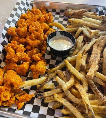 Wing bites and fries in medium sauce