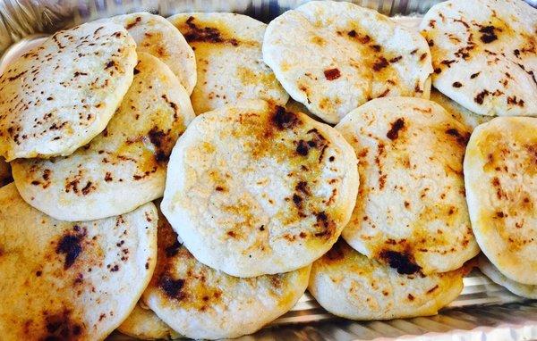 Pork and cheese pupusas made fresh daily