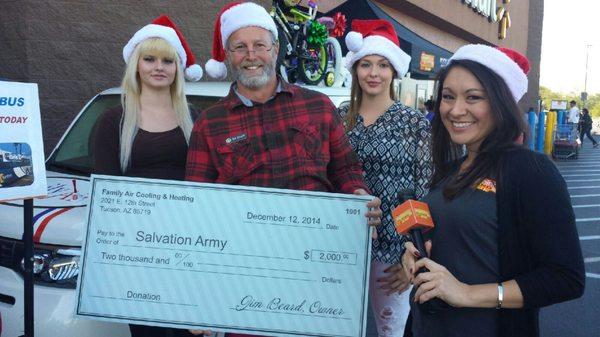 Family Air giving check to Salvation Army