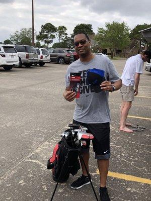 My golf coach had gifts for me today. He thinks I could be the next Tiger Hood!!! That's not my golf coach behind me.