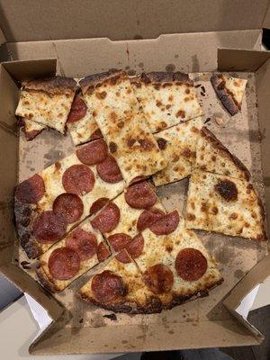 This is what our pizza looked like when we opened the box. Overcooked, cold and clearly tossed on our doorstep when delivered.