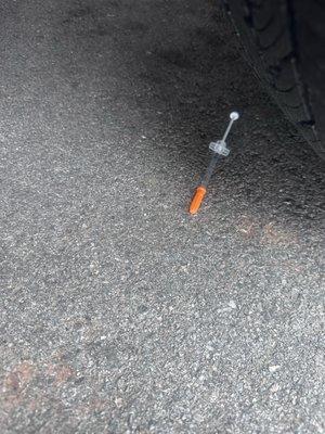 Loaded syringe found in parking lot.