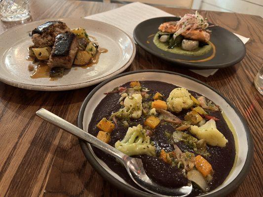 Trout, pork filets and black polenta and cauliflower dish