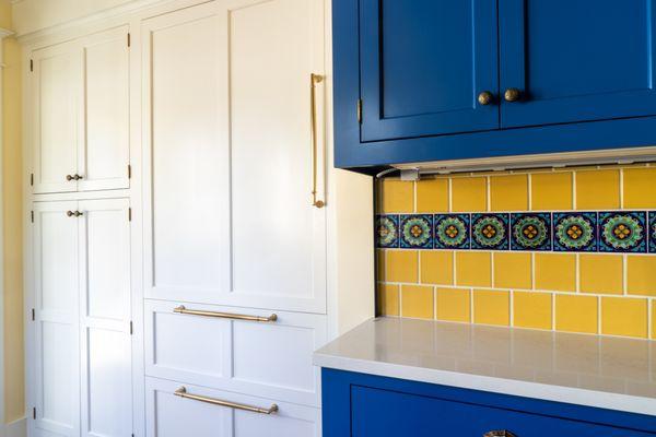 Custom integrated fridge and freezer panels.