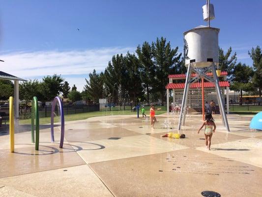 Water canons, tower, 1 of four covered seating areas, and rings that act as a "car wash" for kids to run through with jets of water