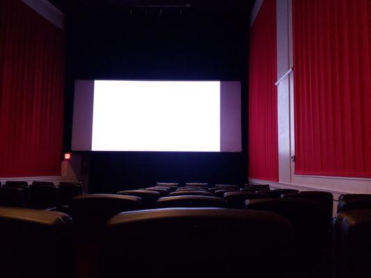 This is inside and half way down the theater.  This place is great with brand new seats. Very comfortable, leather, and rock a bit.