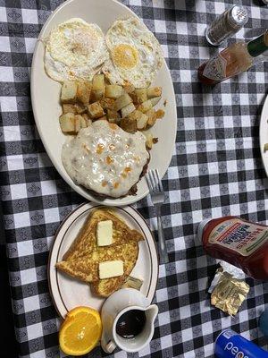 Breakfast country fried steak and eggs with home fries and  side of French toast. Absolutely yummy