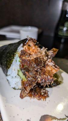 Salmon Skin Hand Roll with Bonito flakes.