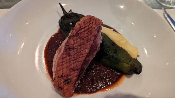 ​pan roasted duck breast, roasted poblano stuffed with polenta, molé sauce