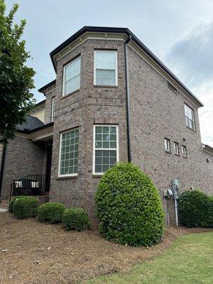 Front of the home with Black Gutters