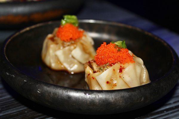 The Shumai are shrimp & pork dumplings topped with garlic tamari sauce, masago, and scallion.