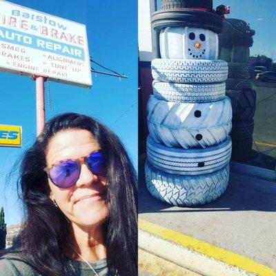 Shop sign and cute little tire snowman in front!!