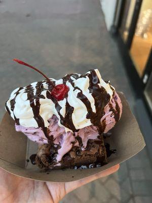 Brownie sundae with blackberry ice cream