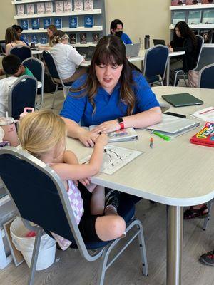 Our sweet Kinder student is working hard on her letter recognition and sounds with her lovely tutor, Miss Peyton.