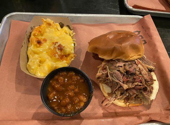 Pulled pork sandwich, baked beans side, side of mac and cheese