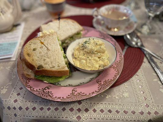 The egg salad sandwich with a side of potato salad