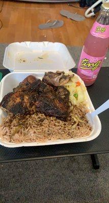 Medium jerk chicken with rice and peas, cabbage, and Pink Ting