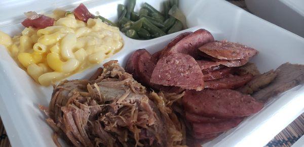 Pulled pork, brisket, sausage mac and cheese and green beans.  Not worth how much we spent.