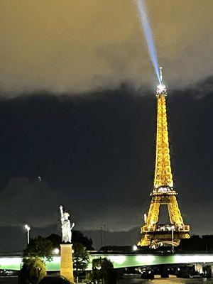 Eiffel Tower and the Original Statue of Liberty by night